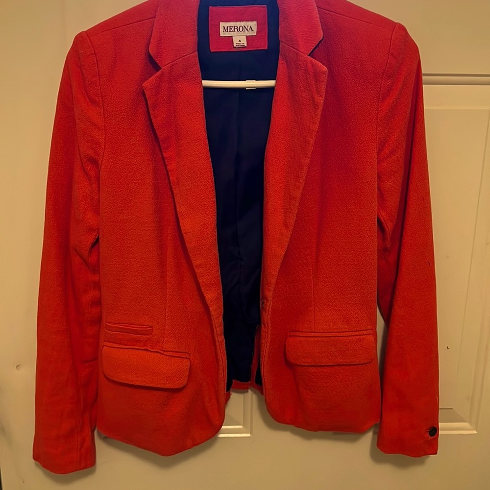 Orange colored blazer . Short length . Lined w/pockets . Size 4